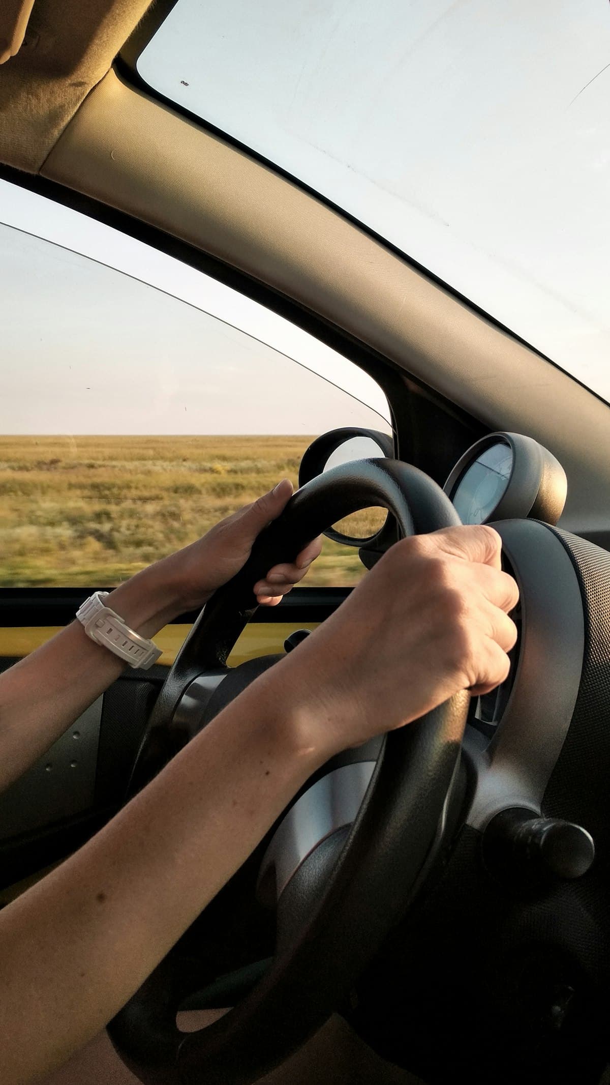 Confident hands on the steering wheel during a refresher lesson