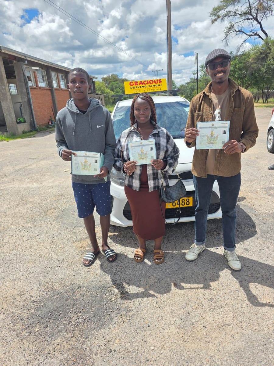 Three graduates on a cloudy test day