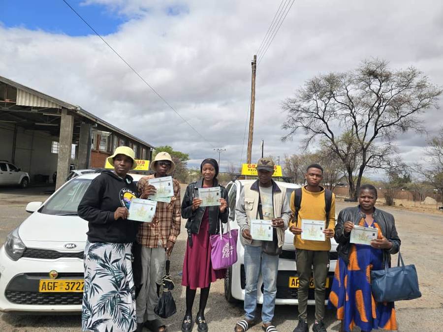 A group celebration with certificates in hand